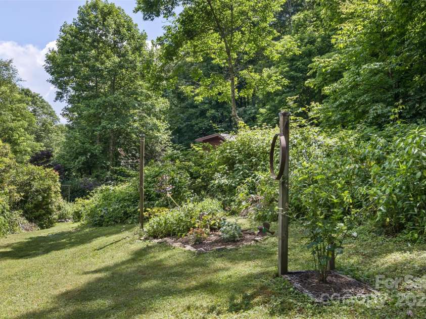 557 Tumbling Fork Road, Waynesville, NC 28785.  MLS# CAR4276307, YatesRealty ID 24432. Upper Garden Area