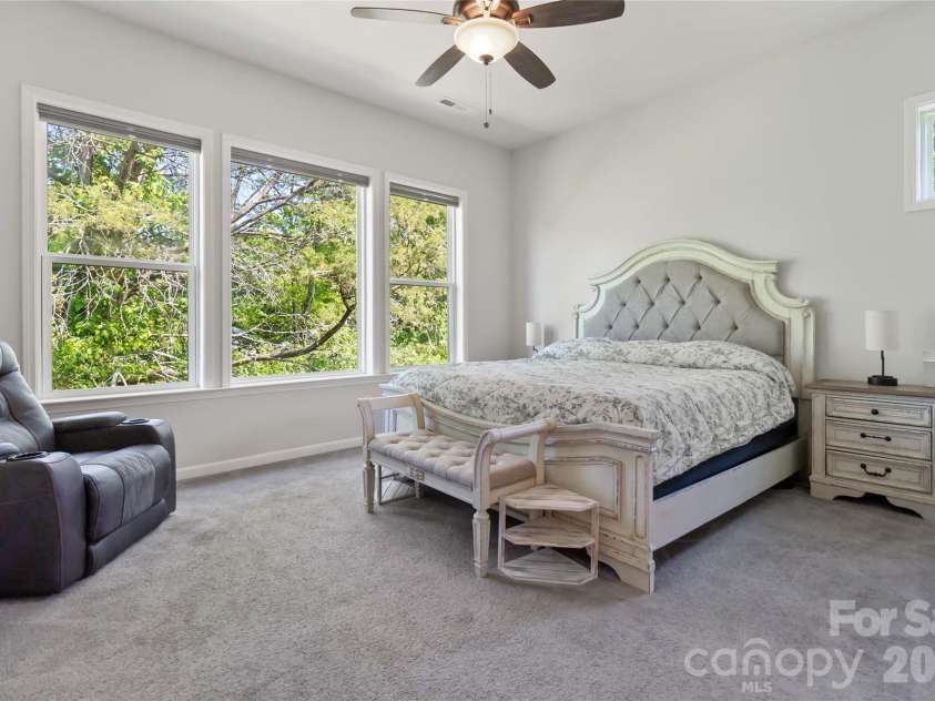 1124 Greenbridge Drive, Matthews, NC 28105.  MLS# CAR4373160, YatesRealty ID 24433. Huge primary bedroom overlooking trees