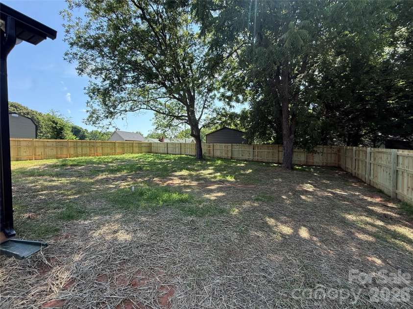 707 Robin Avenue, Kannapolis, NC 28081.  MLS# CAR4382666, YatesRealty ID 24435. Backyard with fence