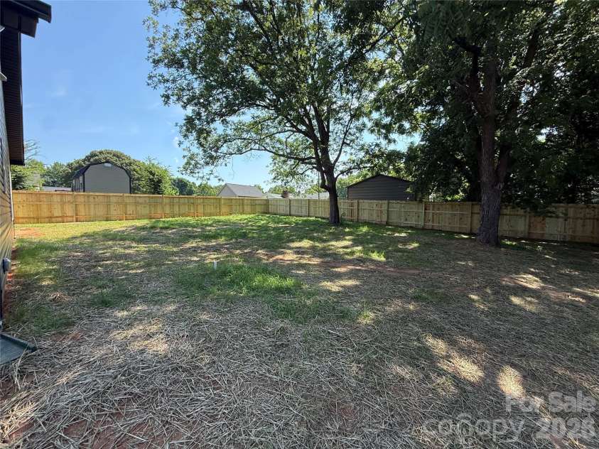 707 Robin Avenue, Kannapolis, NC 28081.  MLS# CAR4382666, YatesRealty ID 24435. Backyard with fence