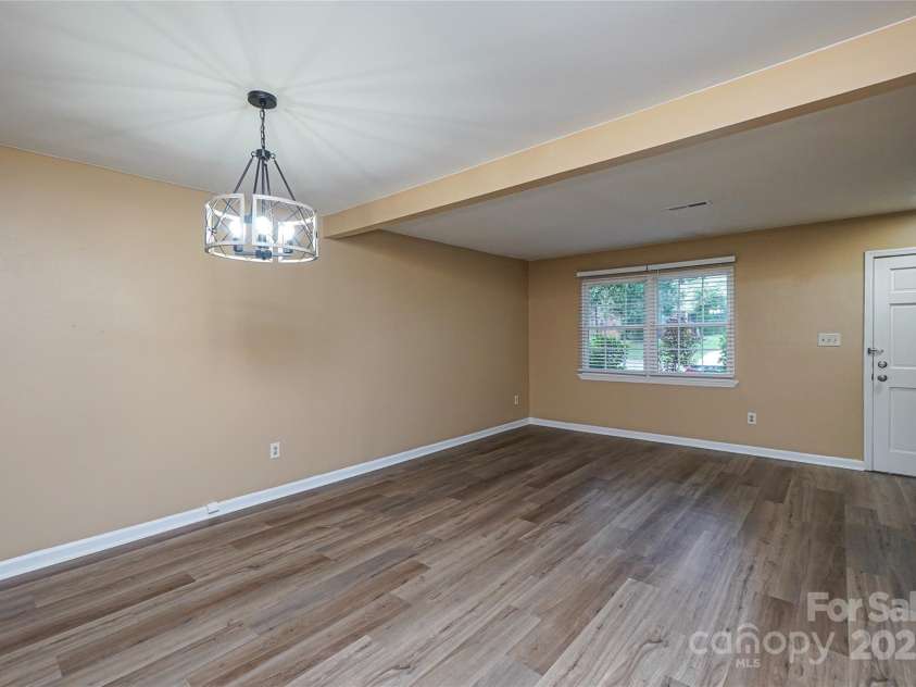 8835 Hunter Ridge Drive, Charlotte, NC 28226.  MLS# CAR4251538, YatesRealty ID 24436. Dining view towards living area