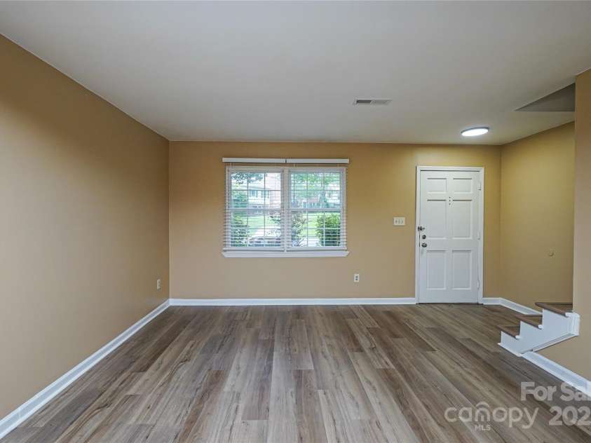 8835 Hunter Ridge Drive, Charlotte, NC 28226.  MLS# CAR4251538, YatesRealty ID 24436. Living area has new flat ceilings and new LVP