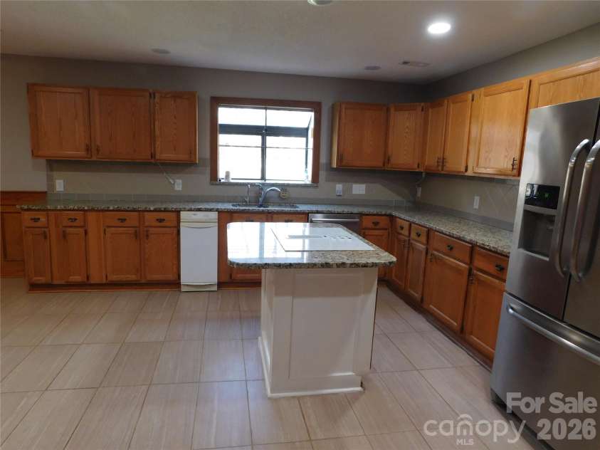 5314 Brookwood Court, Waxhaw, NC 28173.  MLS# CAR4342325, YatesRealty ID 24439. Kitchen view from garage door