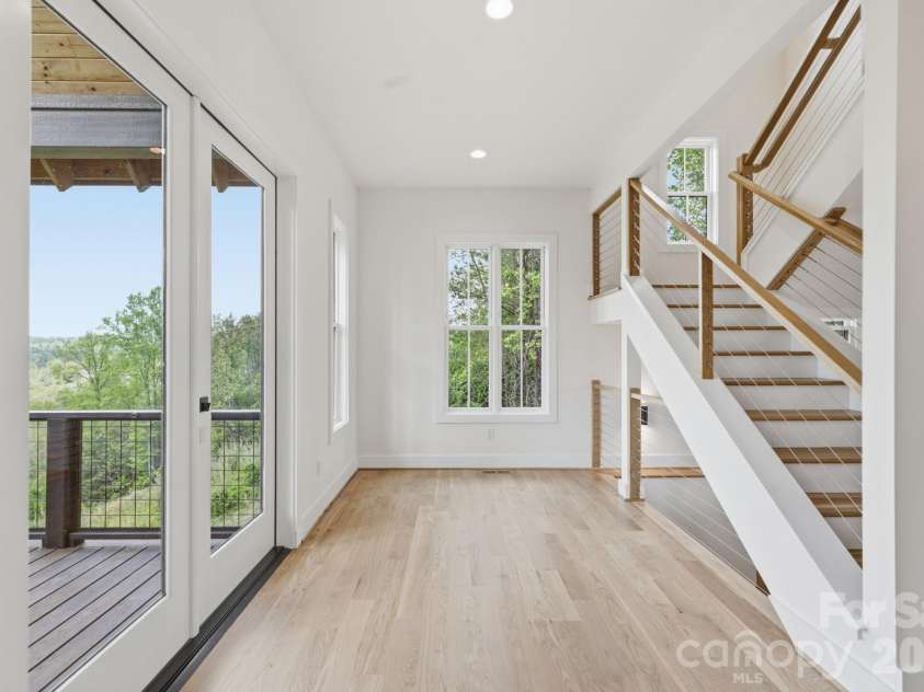 244 Westridge Farm Road, Asheville, NC 28804.  MLS# CAR4371030, YatesRealty ID 24441. Dining area leading to covered, vaulted back porch