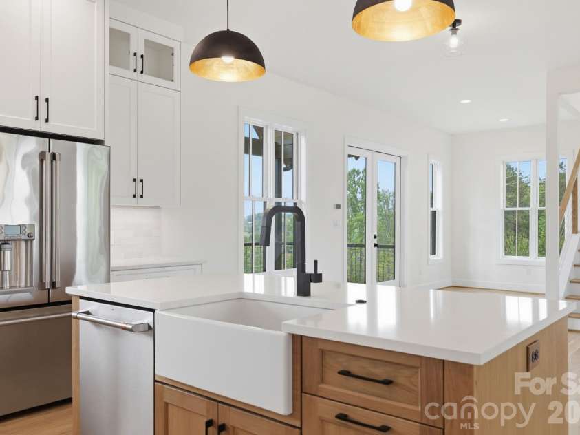 244 Westridge Farm Road, Asheville, NC 28804.  MLS# CAR4371030, YatesRealty ID 24441. Kitchen island feat. farmhouse apron sink and dishwasher