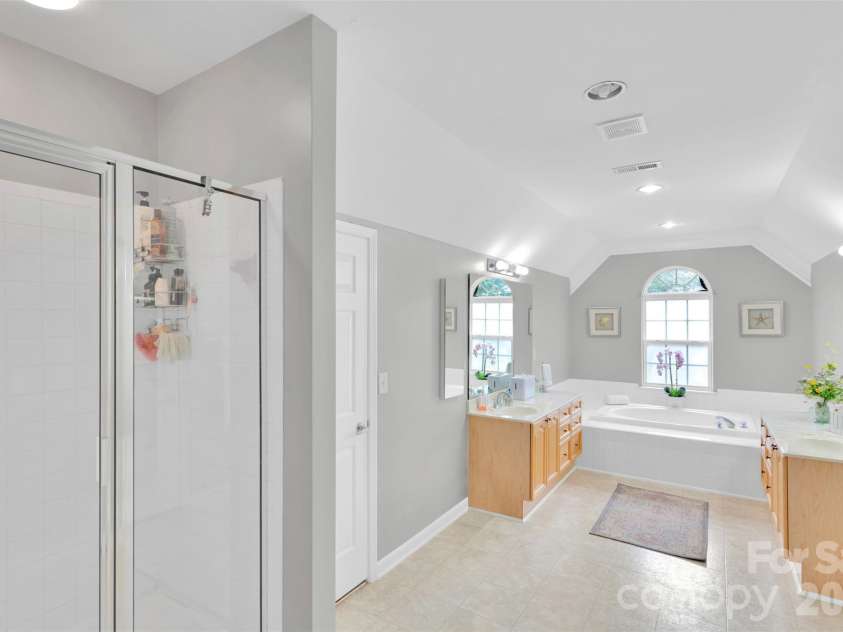 10837 Wilklee Drive, Charlotte, NC 28277.  MLS# CAR4291403, YatesRealty ID 2445. Extended shower - dual sinks and dual walk in closets. Sunken tub for when you want to have your own spa day