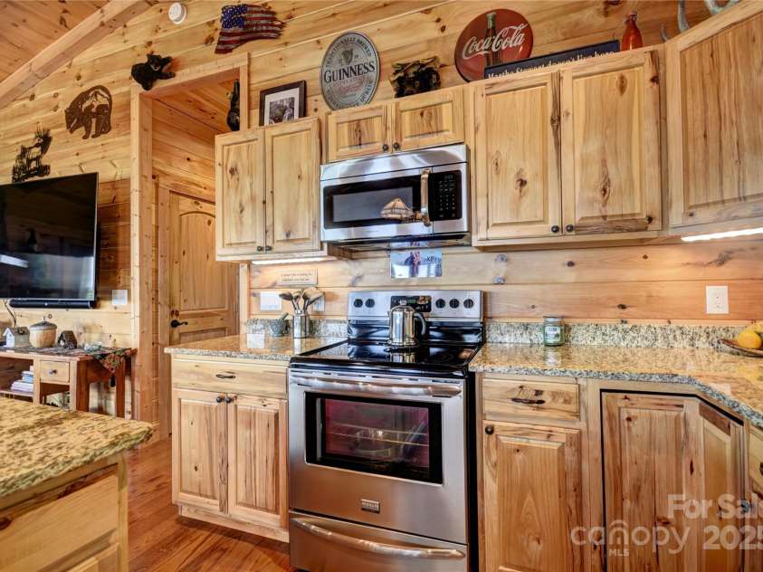 211 Sky Drive, Maggie Valley, NC 28751.  MLS# CAR4276346, YatesRealty ID 24456. Closer View of the Electric Range and Micrrowave
