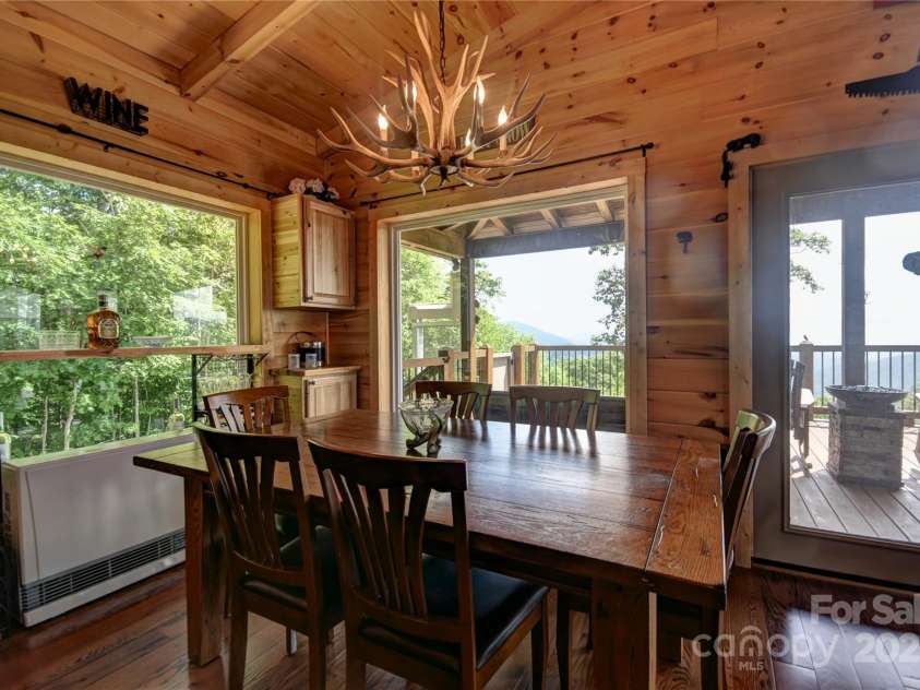 211 Sky Drive, Maggie Valley, NC 28751.  MLS# CAR4276346, YatesRealty ID 24456. Dining Area, with a propane Rinnai Vented Wall Furnace