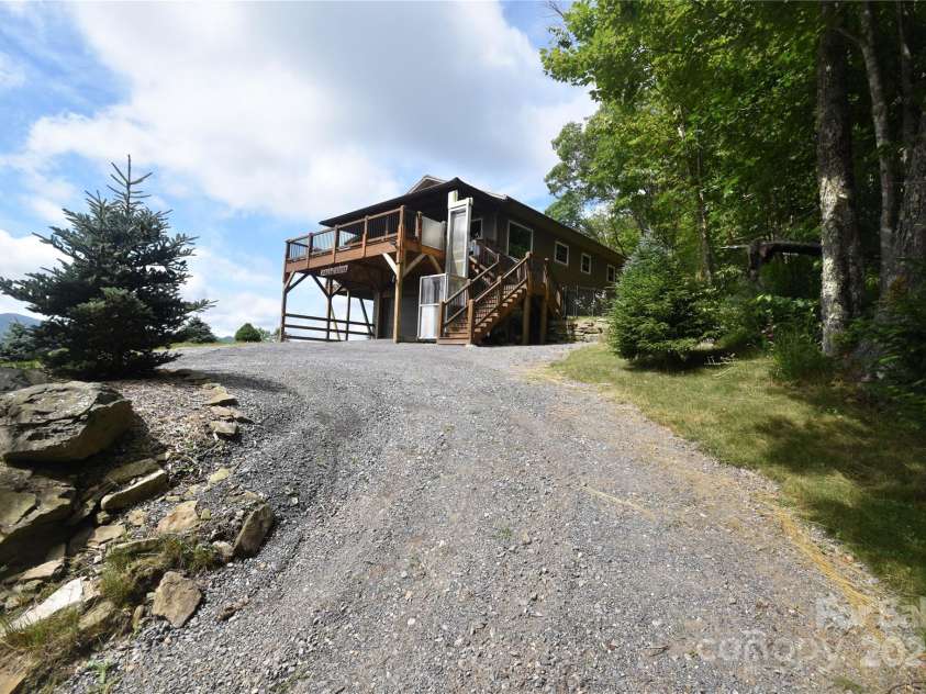 211 Sky Drive, Maggie Valley, NC 28751.  MLS# CAR4276346, YatesRealty ID 24456. Driveway up to the home is well-maintained and wide gravel drive