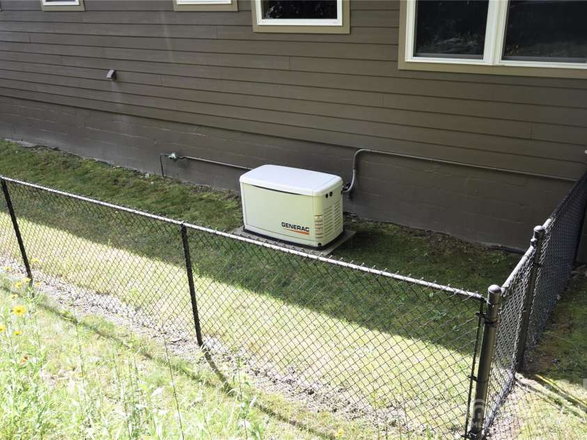 211 Sky Drive, Maggie Valley, NC 28751.  MLS# CAR4276346, YatesRealty ID 24456. Generac 9600KW Generator