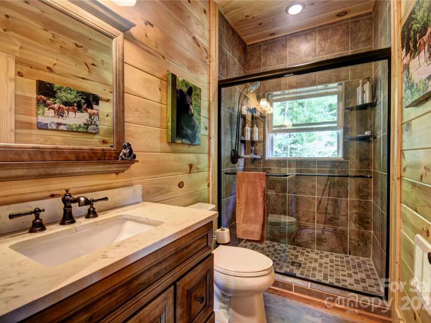 211 Sky Drive, Maggie Valley, NC 28751.  MLS# CAR4276346, YatesRealty ID 24456. Hall Bath with Walk-in Shower