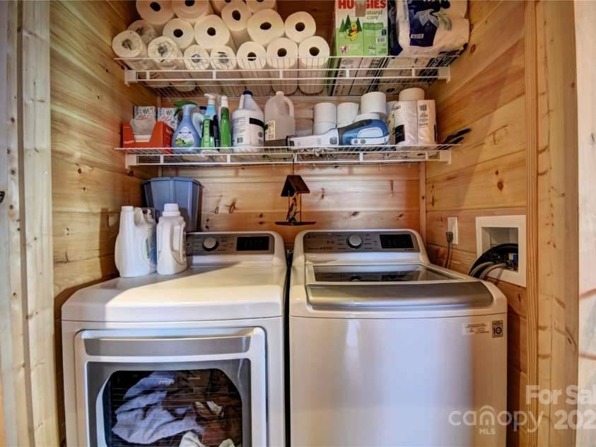 211 Sky Drive, Maggie Valley, NC 28751.  MLS# CAR4276346, YatesRealty ID 24456. Laundry Closet off the hallway- Has barn doors to cover when not in use
