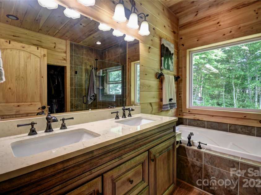 211 Sky Drive, Maggie Valley, NC 28751.  MLS# CAR4276346, YatesRealty ID 24456. Primary Bath with dual vanity sinks