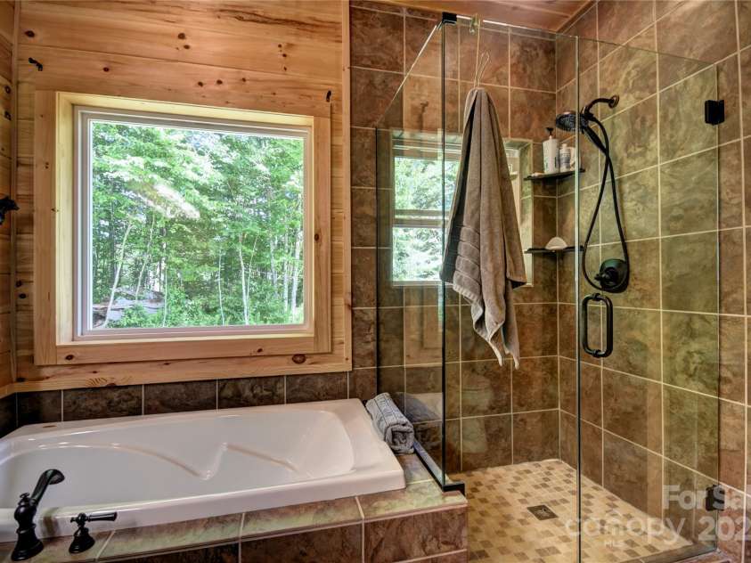 211 Sky Drive, Maggie Valley, NC 28751.  MLS# CAR4276346, YatesRealty ID 24456. Primary Bath with tub and separate shower enclosure
