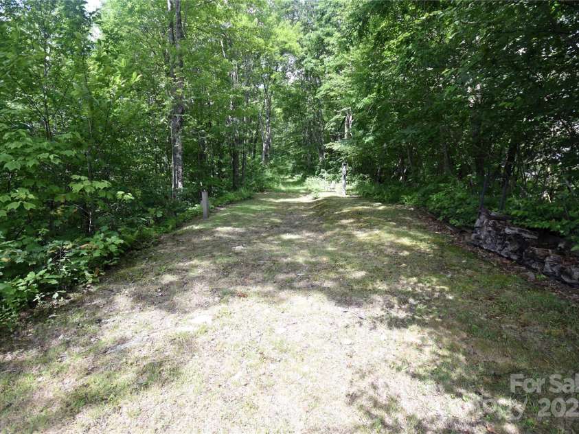 211 Sky Drive, Maggie Valley, NC 28751.  MLS# CAR4276346, YatesRealty ID 24456. The drive (trail) continues up the ridge, the parcel is almost 9 acres