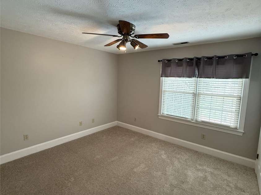 8219 Deer Drive, Harrisburg, NC 28075.  MLS# CAR4372897, YatesRealty ID 24458. Bedroom #3 with twin windows