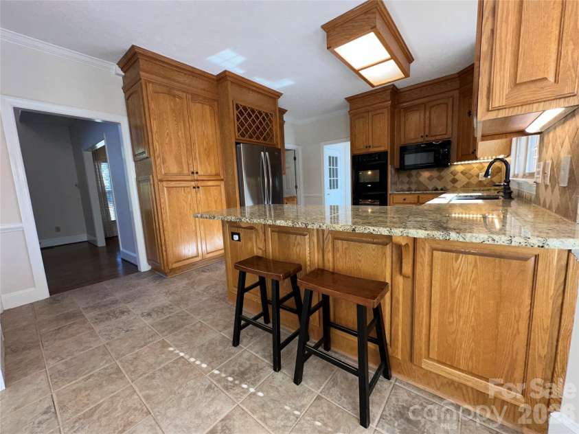 8219 Deer Drive, Harrisburg, NC 28075.  MLS# CAR4372897, YatesRealty ID 24458. Granite Bar area