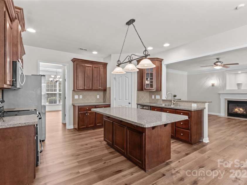 1011 Wadsworth Lane, Indian Trail, NC 28079.  MLS# CAR4273243, YatesRealty ID 24459. Kitchen looking into family room