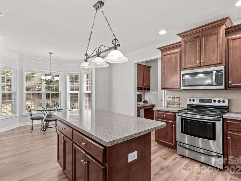 1011 Wadsworth Lane, Indian Trail, NC 28079.  MLS# CAR4273243, YatesRealty ID 24459. Kitchen looking into sunlit breakfast nook