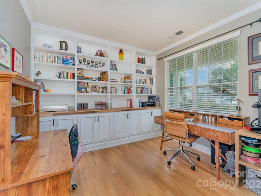 133 Glade Valley Avenue, Mooresville, NC 28117.  MLS# CAR4275294, YatesRealty ID 24460. Main level office with built in shelving and lighting