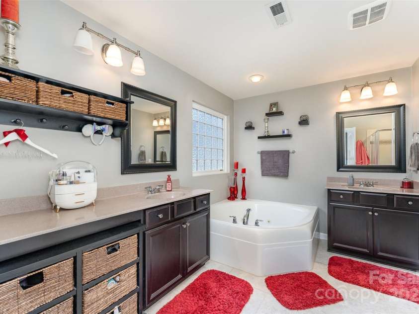 133 Glade Valley Avenue, Mooresville, NC 28117.  MLS# CAR4275294, YatesRealty ID 24460. Primary bath with soaking tub, separate sinks