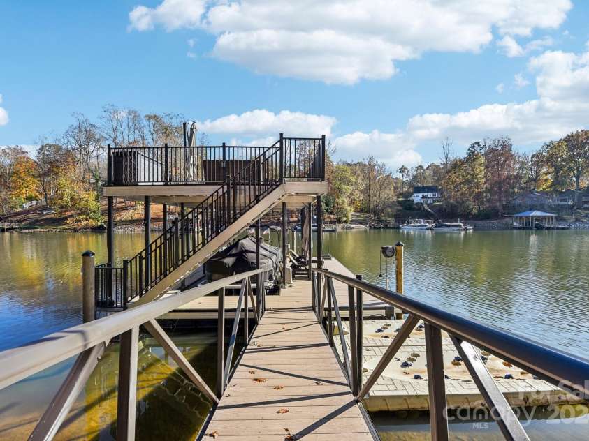 151 River Ridge Lane, Statesville, NC 28677.  MLS# CAR4177532, YatesRealty ID 24462. Floating docks for boat and 2 jet skis with upper level sitting area