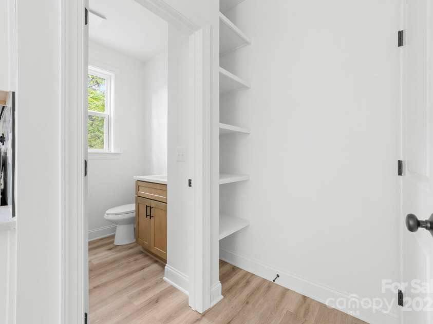 1008 Wilmouth Street, Shelby, NC 28021.  MLS# CAR4331809, YatesRealty ID 24464. View of 1/2 Bathroom & Open Shelving off the Kitchen