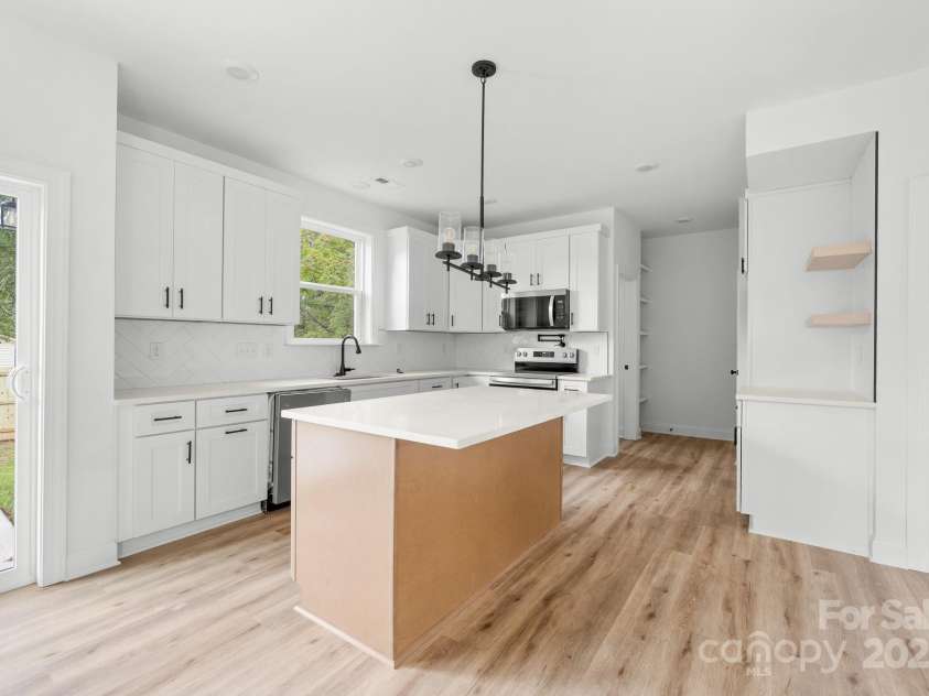 1008 Wilmouth Street, Shelby, NC 28021.  MLS# CAR4331809, YatesRealty ID 24464. View of Kitchen & Coffee Bar from Dining Area