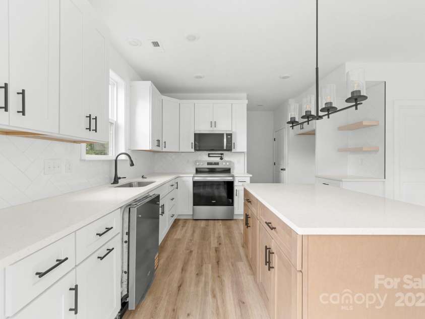 1008 Wilmouth Street, Shelby, NC 28021.  MLS# CAR4331809, YatesRealty ID 24464. View of Kitchen & Coffee Bar from the Dining Area