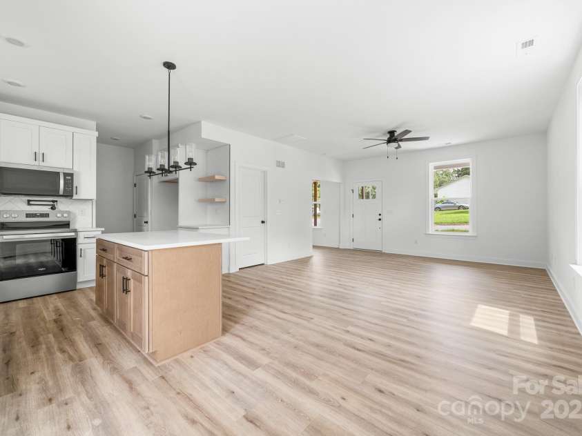 1008 Wilmouth Street, Shelby, NC 28021.  MLS# CAR4331809, YatesRealty ID 24464. View of Kitchen, Dining Area, & Great Room from Sliding Glass Doors to the Patio