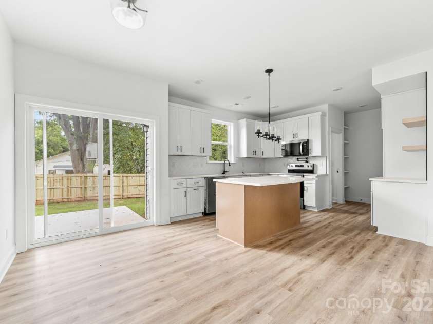 1008 Wilmouth Street, Shelby, NC 28021.  MLS# CAR4331809, YatesRealty ID 24464. View of Kitchen & Sliding Glass Doors to the Patio and Backyard from Great Room