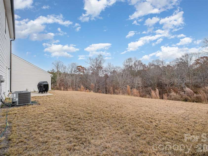 3048 Pinehills Way, Mount Holly, NC 28120.  MLS# CAR4322547, YatesRealty ID 2447. Spacious, flat yard