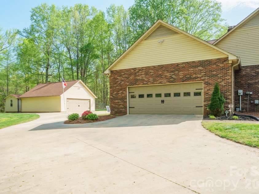 209 Frontier Circle, China Grove, NC 28023.  MLS# CAR4330628, YatesRealty ID 24471. Side Garage View