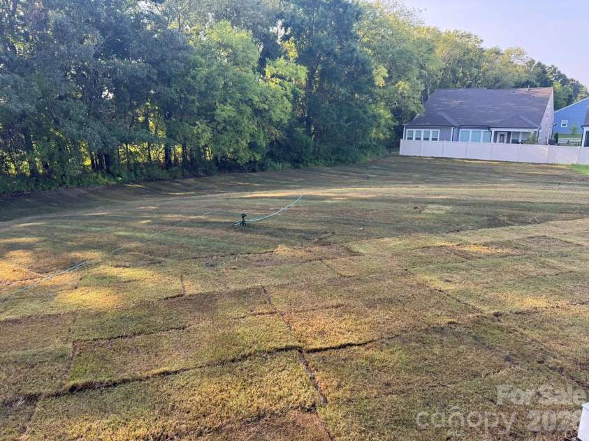 7001 Bil-Mar Drive, Harrisburg, NC 28075.  MLS# CAR4376666, YatesRealty ID 24474. Backyard