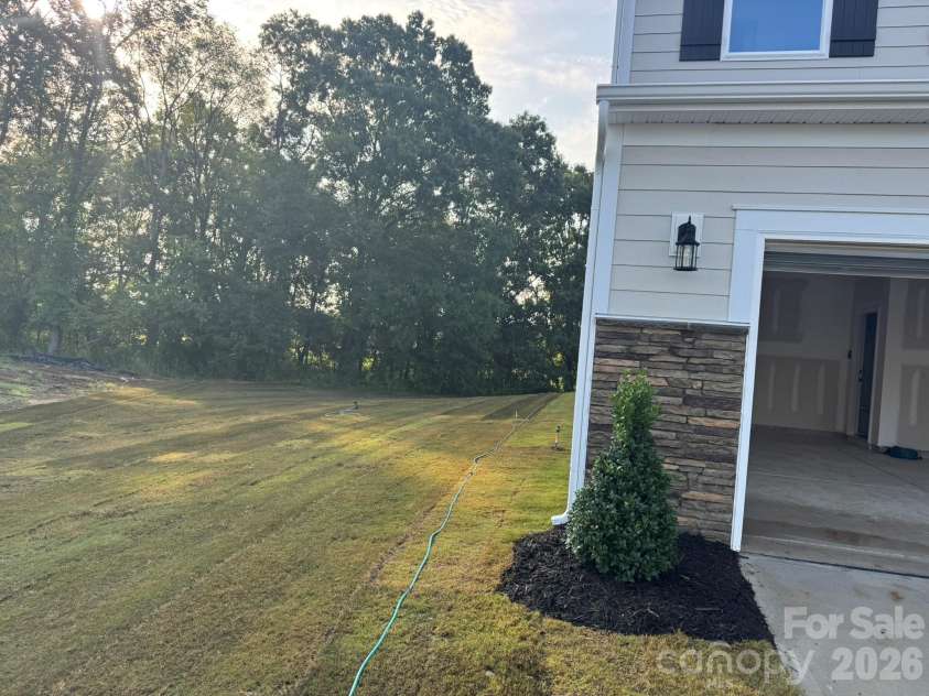 7001 Bil-Mar Drive, Harrisburg, NC 28075.  MLS# CAR4376666, YatesRealty ID 24474. Side yard