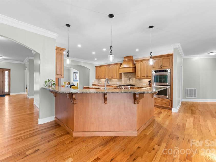148 Castle Drive, Mooresville, NC 28117.  MLS# CAR4220201, YatesRealty ID 2448. Bar height counter for additional seating
