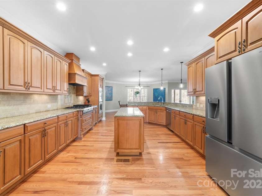 148 Castle Drive, Mooresville, NC 28117.  MLS# CAR4220201, YatesRealty ID 2448. From the sitting room looking into the kitchen