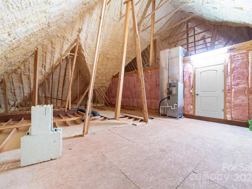 148 Castle Drive, Mooresville, NC 28117.  MLS# CAR4220201, YatesRealty ID 2448. Side 1 of walk in attic storage off bonus room