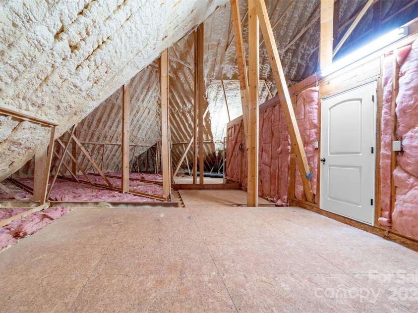 148 Castle Drive, Mooresville, NC 28117.  MLS# CAR4220201, YatesRealty ID 2448. Side 2 of walk in attic space off bonus room