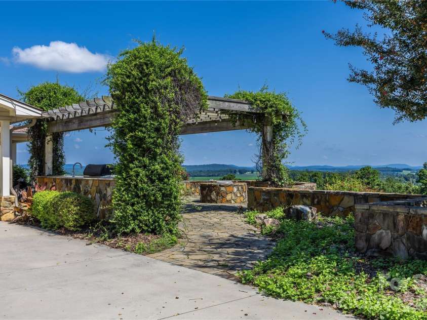 6350 Roscoe Road, Denton, NC 27239.  MLS# CAR4393192, YatesRealty ID 2448. Propane firepit, grill, sink with hot water