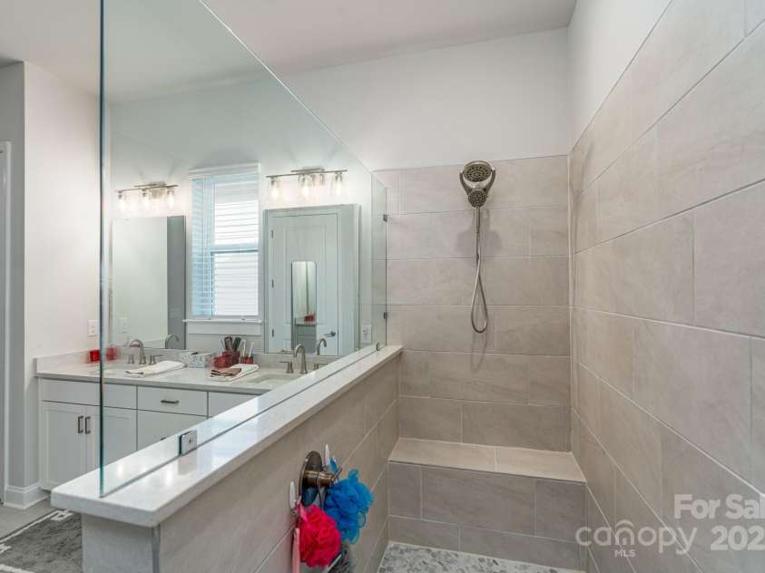 1038 Idyllic Lane, Waxhaw, NC 28173.  MLS# CAR4331673, YatesRealty ID 24480. Primary Bathroom Super Shower with zero entry
