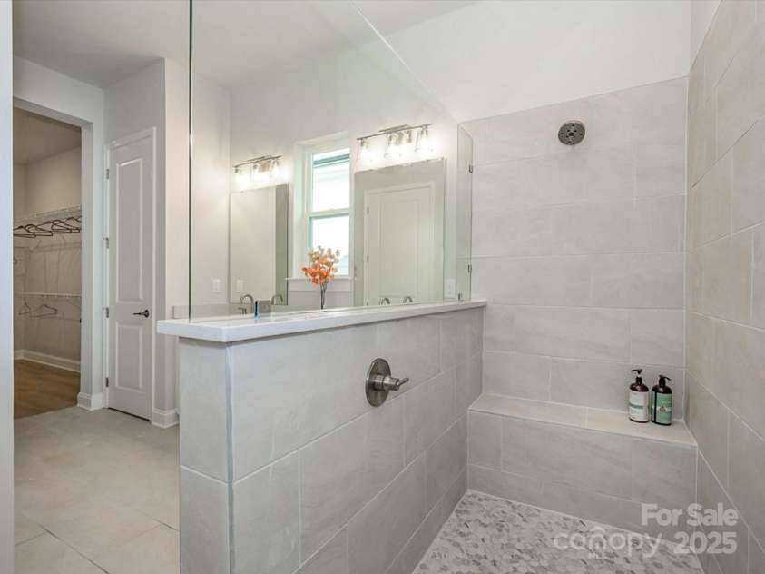 1038 Idyllic Lane, Waxhaw, NC 28173.  MLS# CAR4331673, YatesRealty ID 24480. Primary Bathroom zero entry Shower