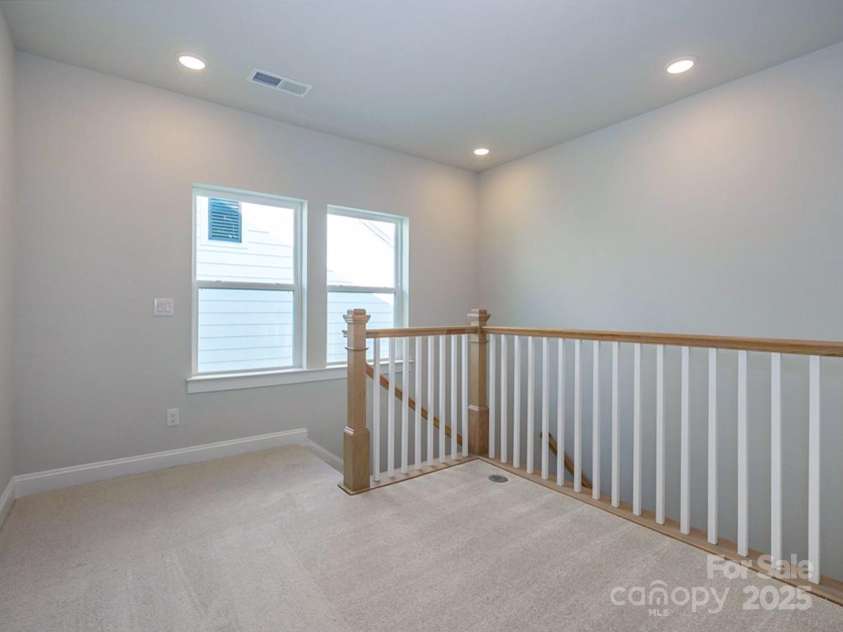 1038 Idyllic Lane, Waxhaw, NC 28173.  MLS# CAR4331673, YatesRealty ID 24480. Upper Level Loft or Flex Area