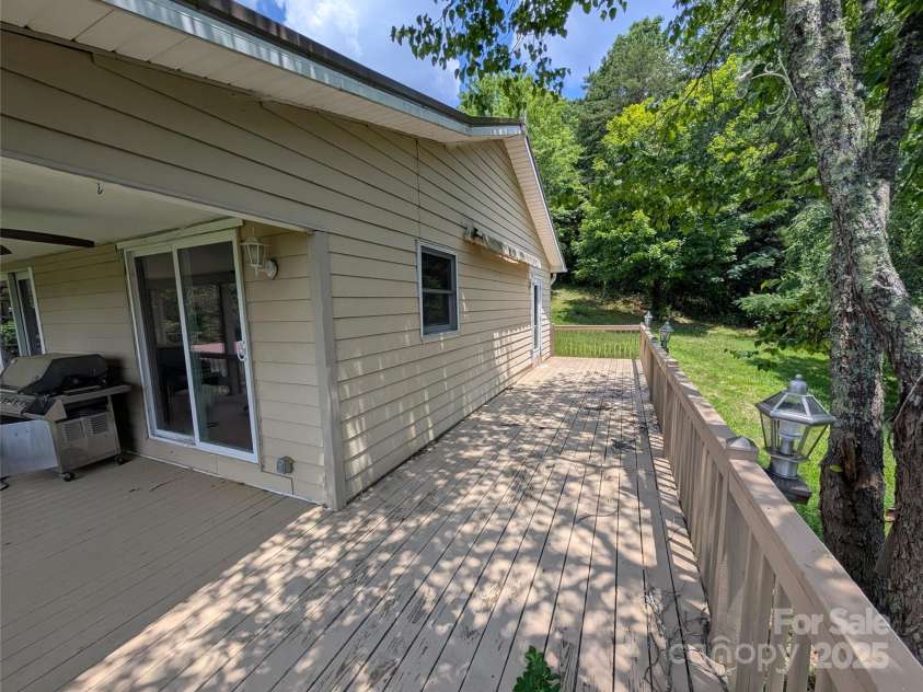 403 Union Hill Road, Hendersonville, NC 28792.  MLS# CAR4278795, YatesRealty ID 24484. Nice uncovered deck space with rollout sunshade