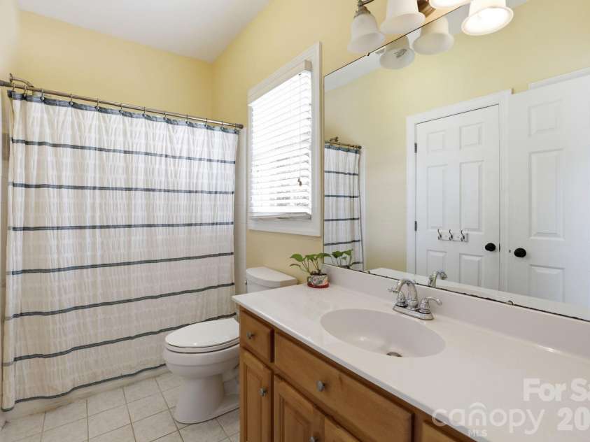 239 Sardis Pointe Road, Matthews, NC 28105.  MLS# CAR4373464, YatesRealty ID 24492. Secondary bedroom