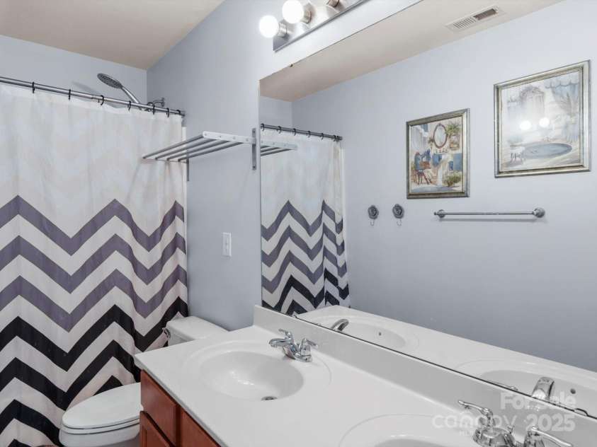 5003 Singletree Lane, Indian Trail, NC 28079.  MLS# CAR4259465, YatesRealty ID 24498. Hall Bathroom