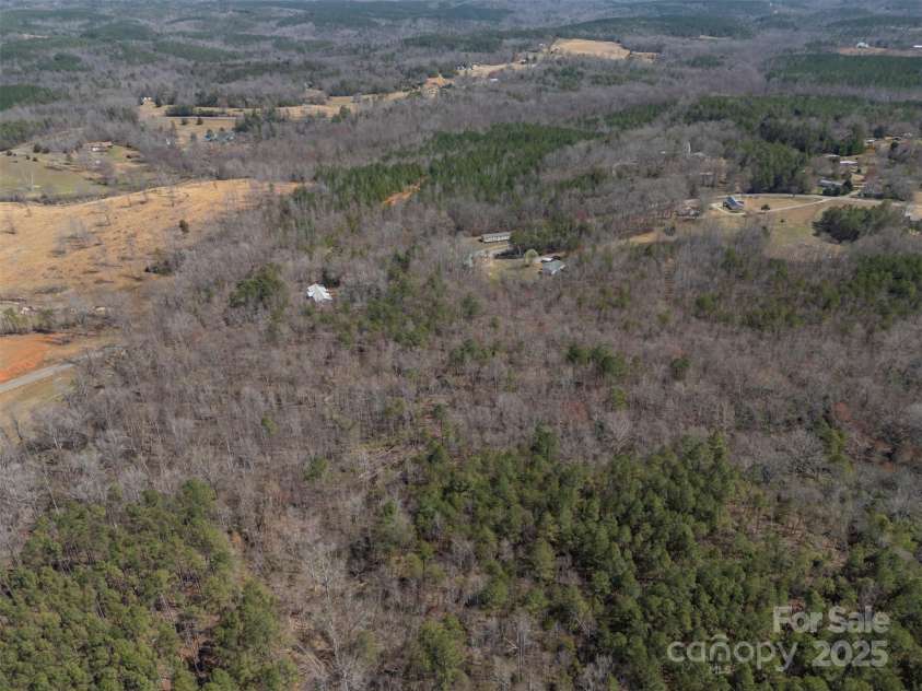 582 County Line Road, Rutherfordton, NC 28139.  MLS# CAR4235377, YatesRealty ID 245. Aerial from back of acreage