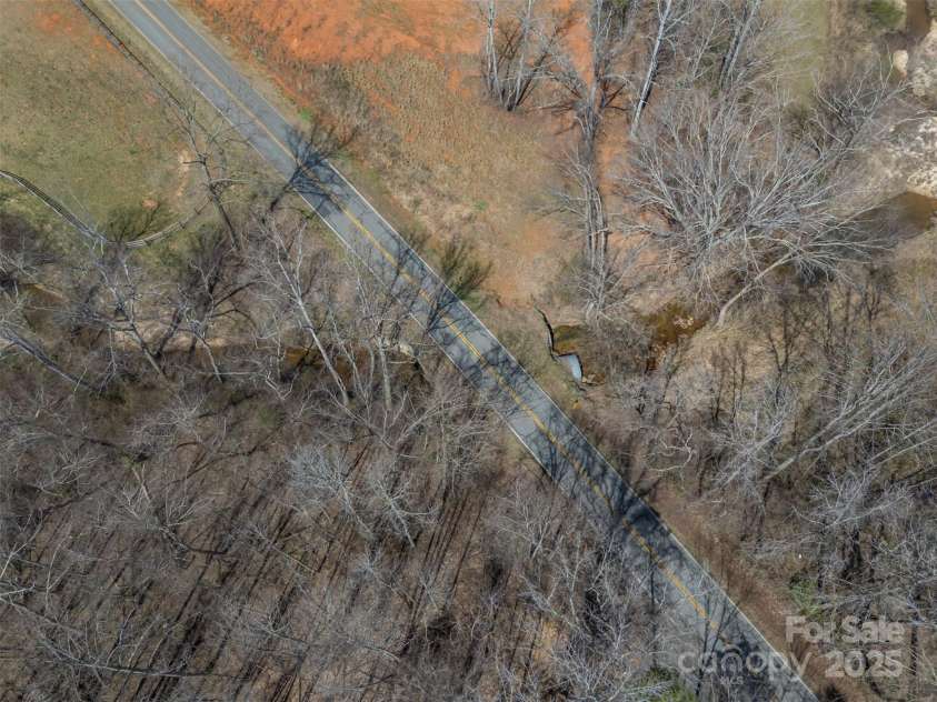 582 County Line Road, Rutherfordton, NC 28139.  MLS# CAR4235377, YatesRealty ID 245. Aerial of frontage at creek
