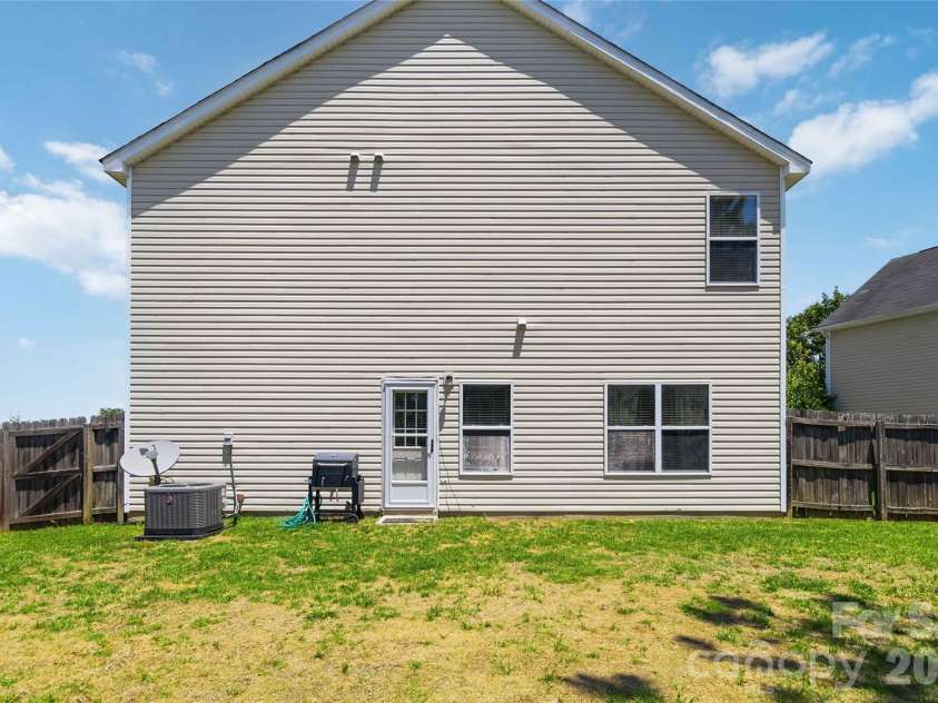 1839 Bray Drive, Charlotte, NC 28214.  MLS# CAR4374895, YatesRealty ID 24512. Side yard area