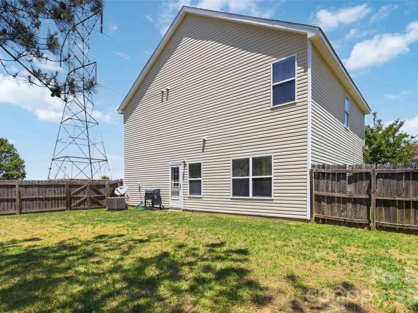1839 Bray Drive, Charlotte, NC 28214.  MLS# CAR4374895, YatesRealty ID 24512. Side yard/fence down